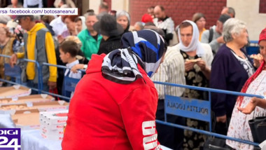 Video Hram cu pizza în loc de tradiționalele sarmale la o biserică din Botoșani. Enoriașii au stat la coadă pentru mâncare